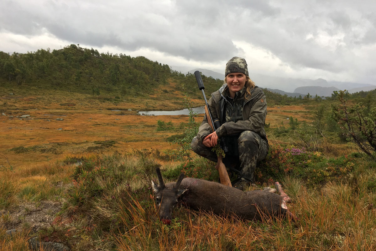 Huntress with a shot reindeer calf